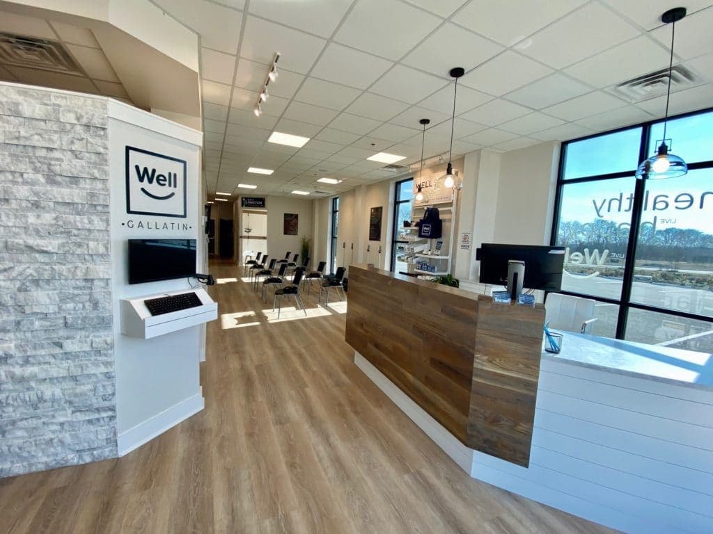 Reception counter and seating inside Well Health & Chiropractic Gallatin