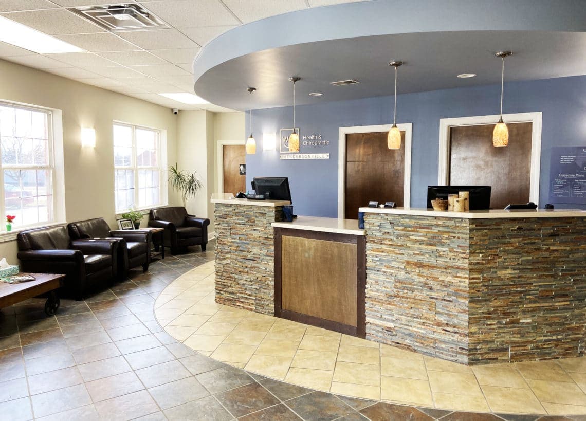 Curved reception desk and waiting area at Well Health & Chiropractic Hendersonville