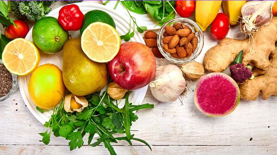 image of fresh fruit, nuts and greens