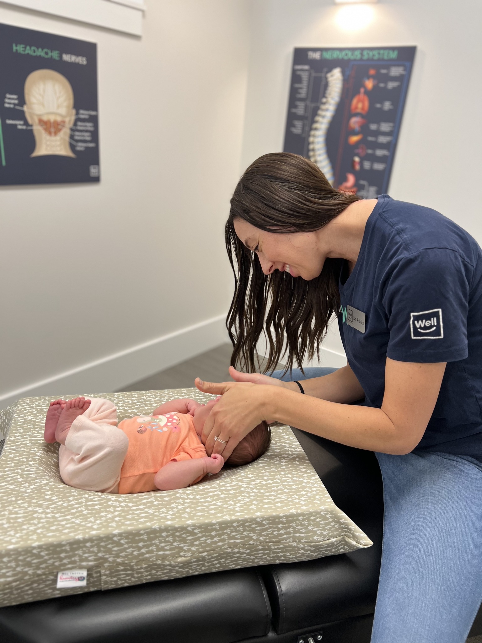 Infant chiropractic adjustment at Well Health Centers — gentle care for babies