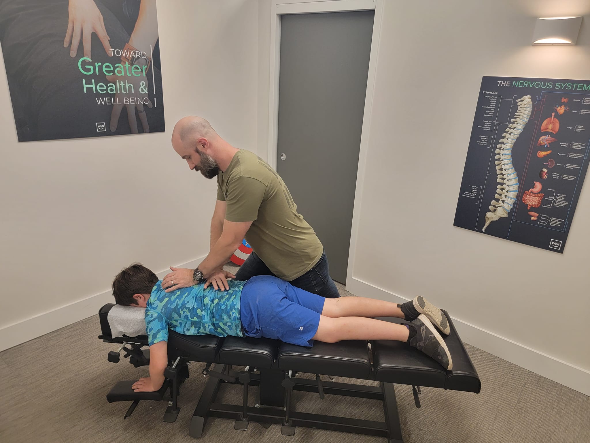 Family chiropractic adjustment at Well Health Centers Dickson, TN
